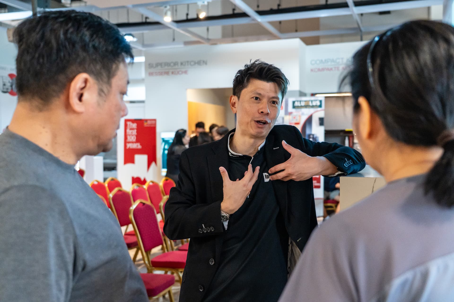 Russell Chin answering homeowners' questions one-to-one after a talk